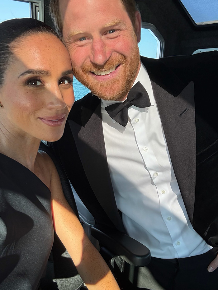 Meghan Markle and Prince Harry pose for a selfie, Meghan smiles at the camera while Harry grins. Meghan Markle and Prince Harry pose for a selfie, Meghan smiles at the camera while Harry grins.