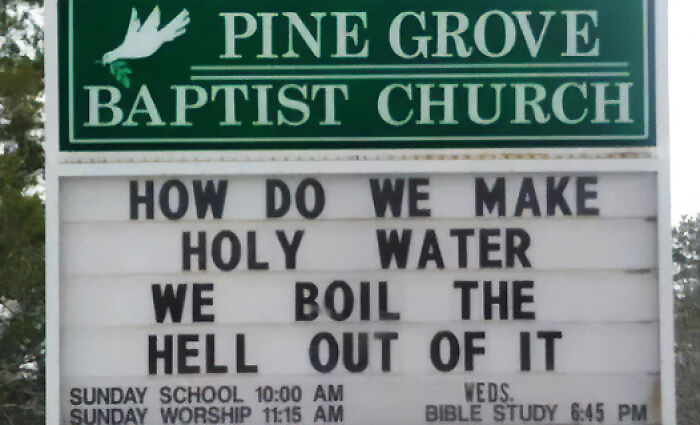 A chaotic sign from Pine Grove Baptist Church reading, How Do We Make Holy Water? We Boil The Hell Out Of It.
