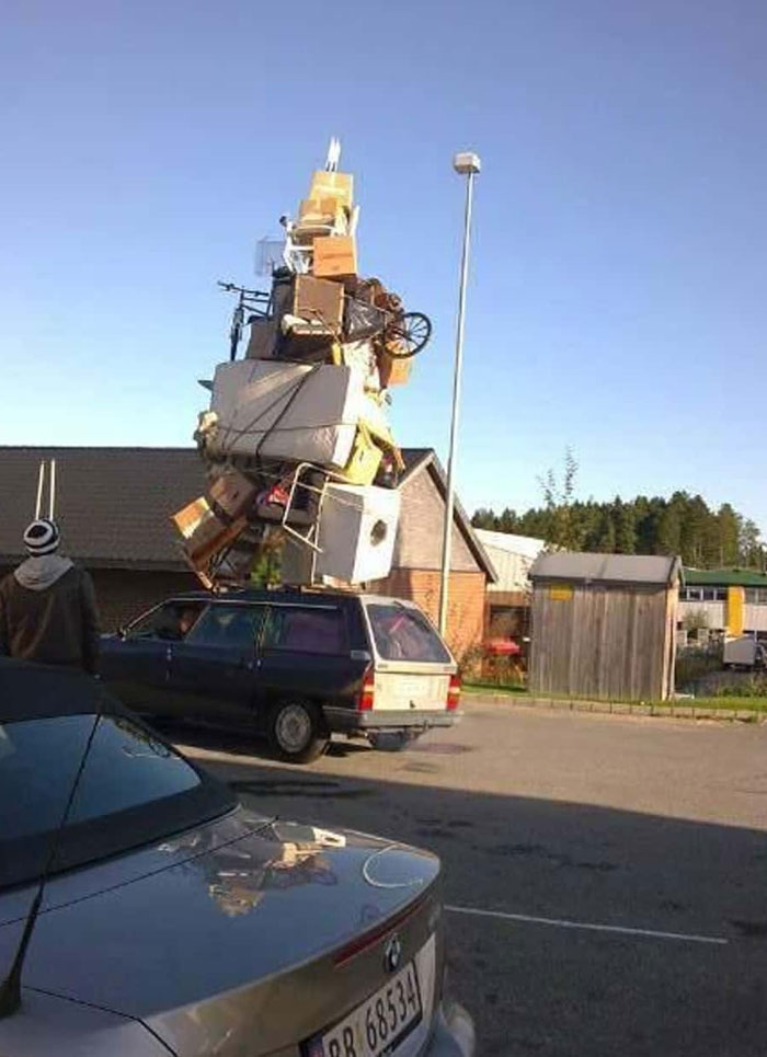 Station wagon carrying an extreme pile of furniture in moving fails pics