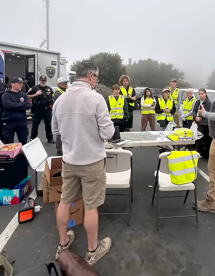 Search team meeting at outdoor command center for wife missing six months case