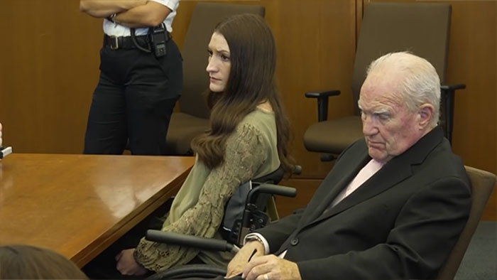 Lindsay Clancy and an older man in court during the verdict chaos. Lindsay Clancy and an older man in court during the verdict chaos.