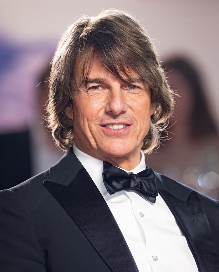 Tom Cruise on the red carpet, a famous face with Hollywood secrets.