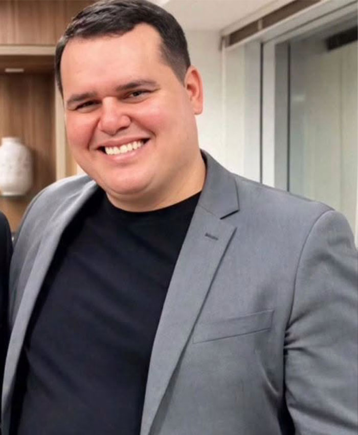 A smiling boss in a grey suit representing a 22yo daughter dating her boss A smiling boss in a grey suit representing a 22yo daughter dating her boss