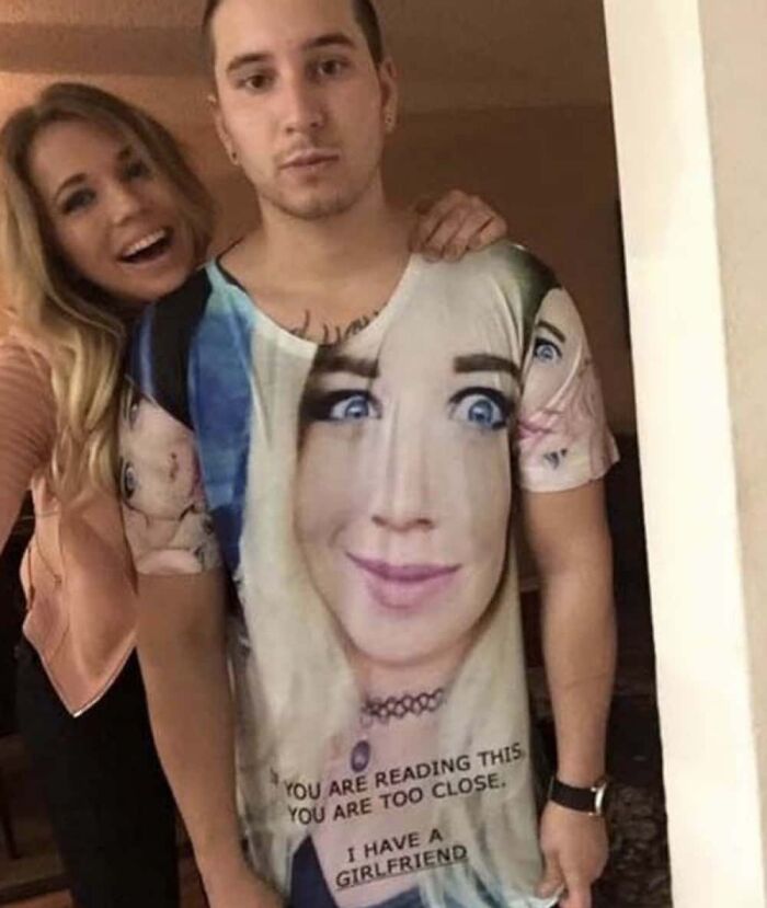 A man wearing a T-shirt with a woman's face and text, a hilarious photo.