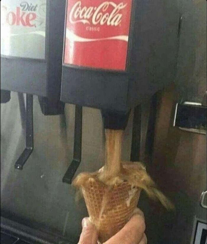 Someone uses a Coca-Cola soda dispenser to fill an ice cream cone with soda, a hilarious photo from the Internet.