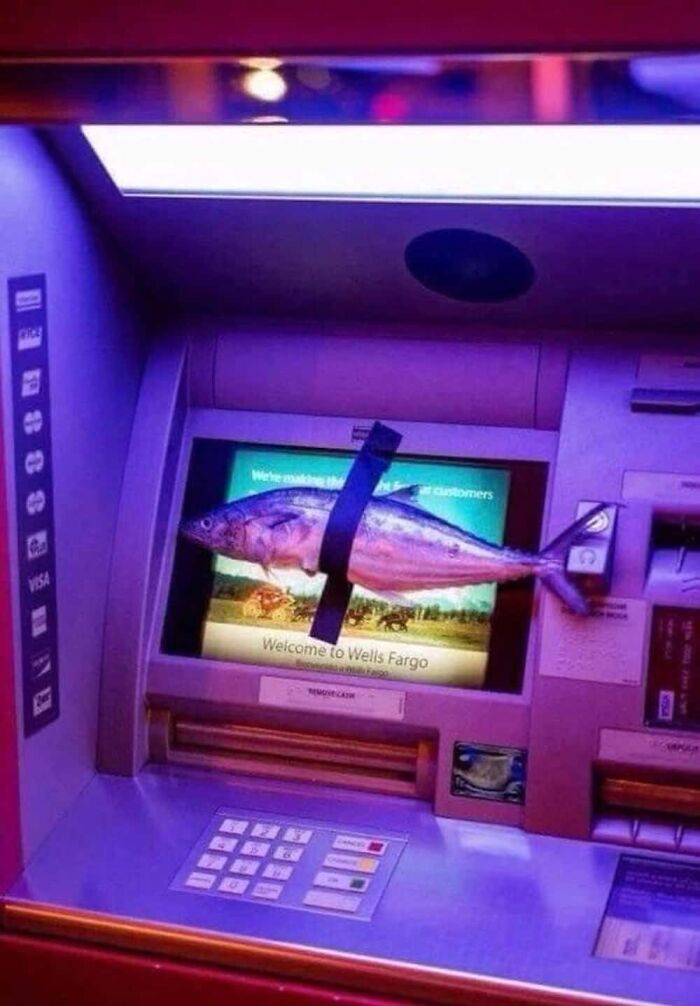 A large fish is taped to the screen of an ATM machine, a hilarious photo circulating the Internet.