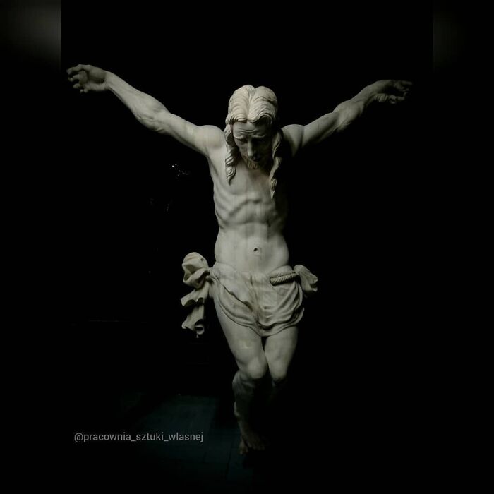 Lifelike wood sculpture of Jesus Christ on the cross made by a Polish artist