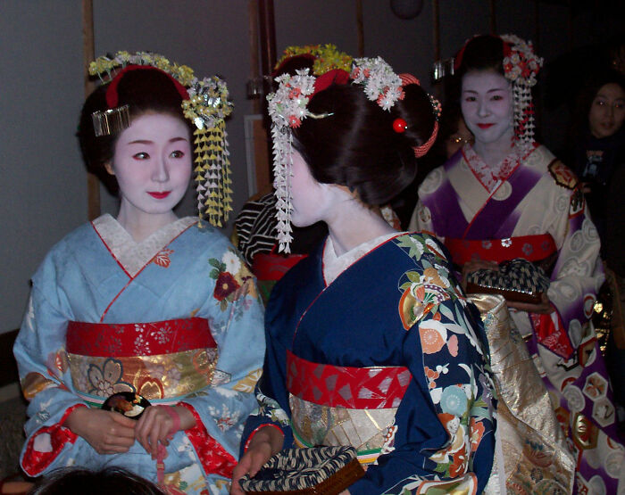 Japanese women in traditional attire, sparking debate about Western beauty standards. Japanese women in traditional attire, sparking debate about Western beauty standards.
