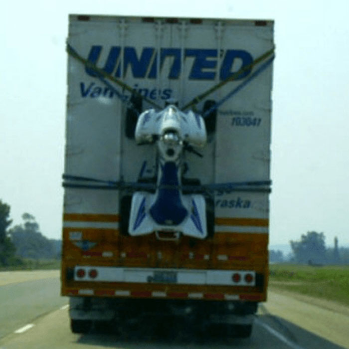 Moving fails image of United Van Lines truck with motorcycle strapped to rear door
