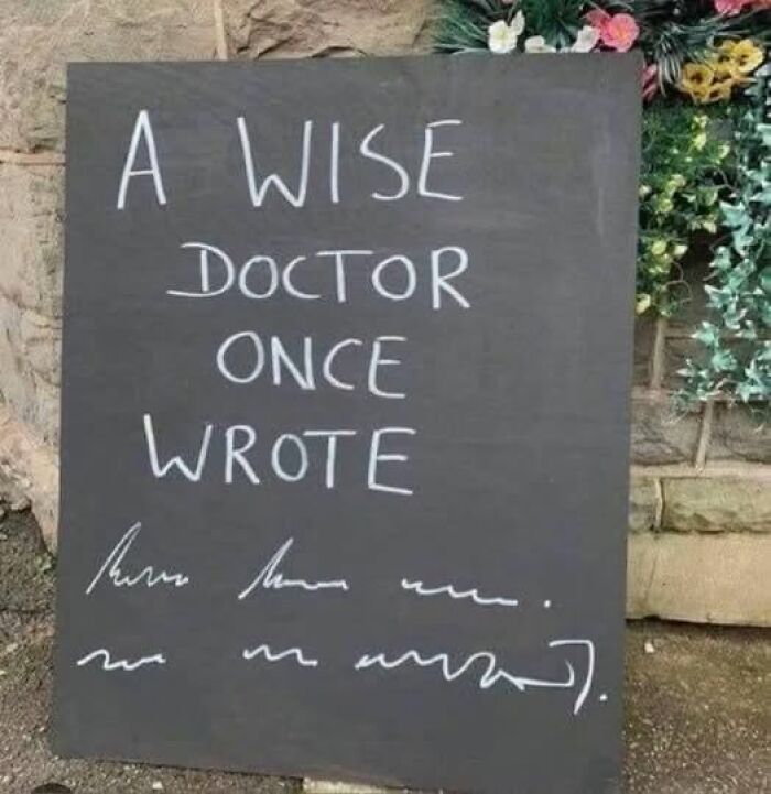 A silly funny sign on a chalkboard begins A WISE DOCTOR ONCE WROTE with illegible scribbles below.
