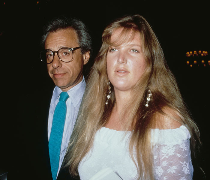 A man in glasses and a young woman, Dorothy Stratten, a beauty goddess, are pictured together. A man in glasses and a young woman, Dorothy Stratten, a beauty goddess, are pictured together.