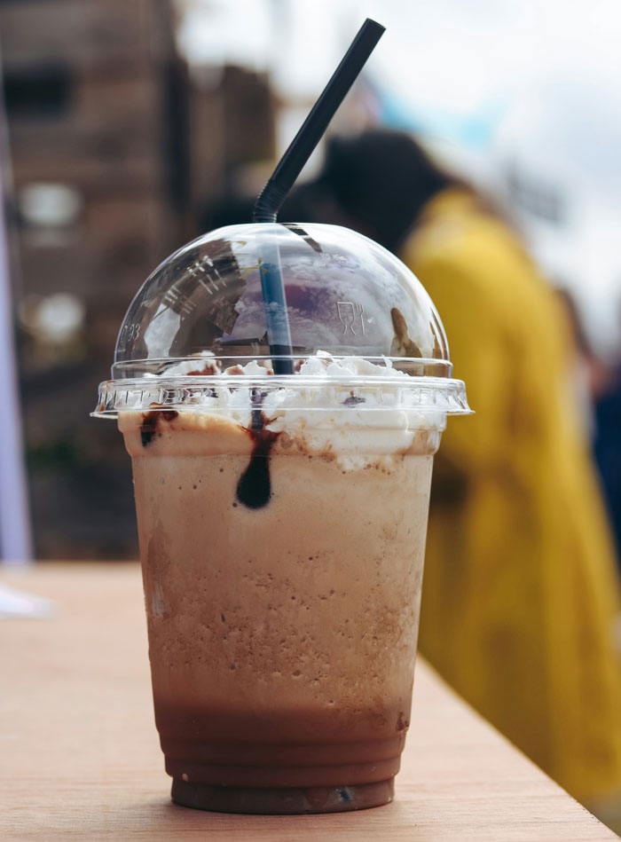 A refreshing frozen coffee drink with whipped cream and chocolate syrup, a story of karma making people get what they deserve.