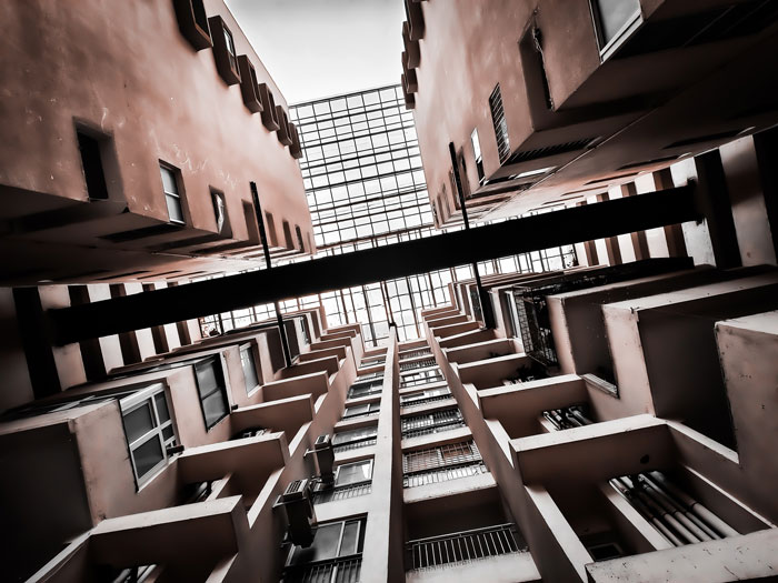 An upward view of a tall building, symbolizing the impressive and scary lengths women go to get a crush.