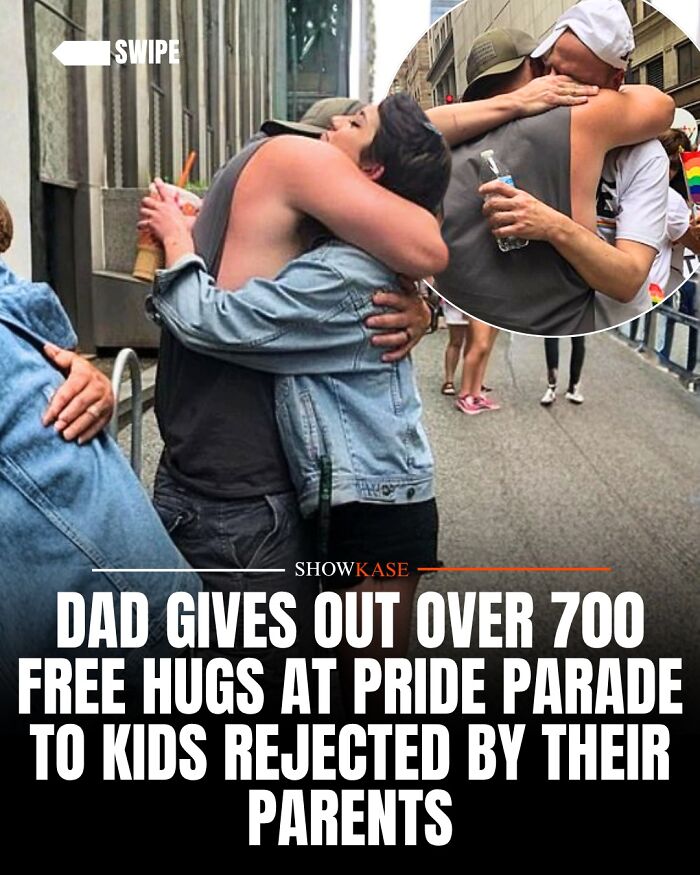 Wholesome stories: A dad gives a warm, loving hug at a Pride parade.