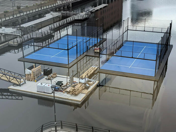 Two floating padel courts side by side, creating a optical illusion of a giant game controller.