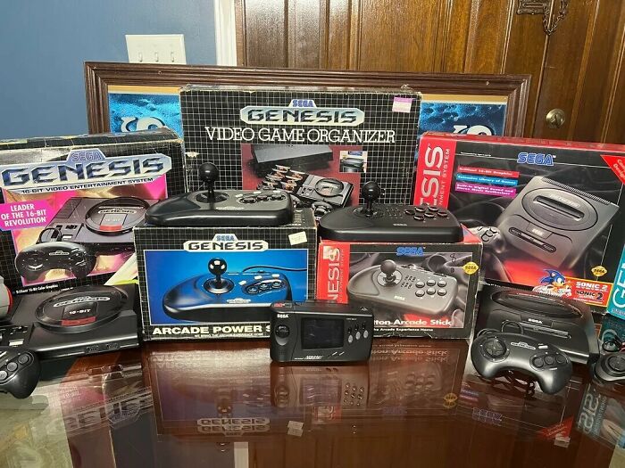 A collection of Sega Genesis retro tech and video game organizers from the 80s, showcasing glorious weirdness.