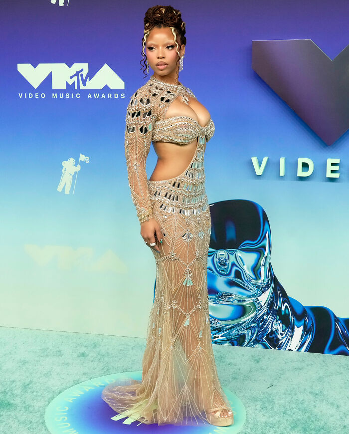 Celebrity in beaded sheer gown at 22 VMAs red carpet event