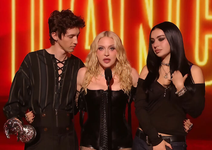Madonna on stage with other artists during her VMAs performance. Madonna on stage with other artists during her VMAs performance.