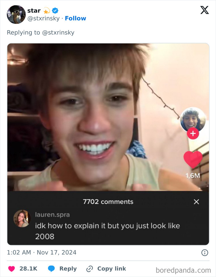 A young man smiling in a video, with a funny comment section noting he looks like 2008.