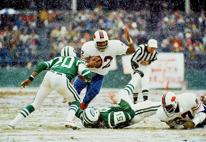 O.J. Simpson, a public figure, playing football in the snow, associated with destroying his legacy.