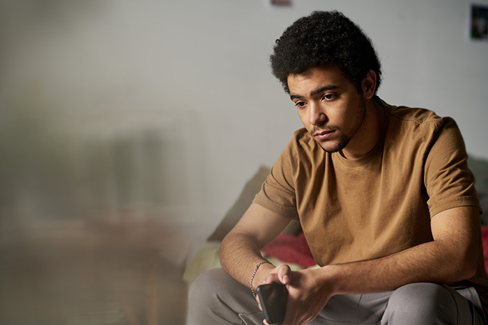 A thoughtful man, reflecting on not saving his half-siblings from foster care.