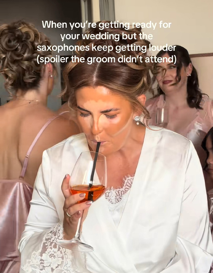 A bride sips a drink, getting ready for a destination wedding, but the groom didn't attend. A bride sips a drink, getting ready for a destination wedding, but the groom didn't attend.