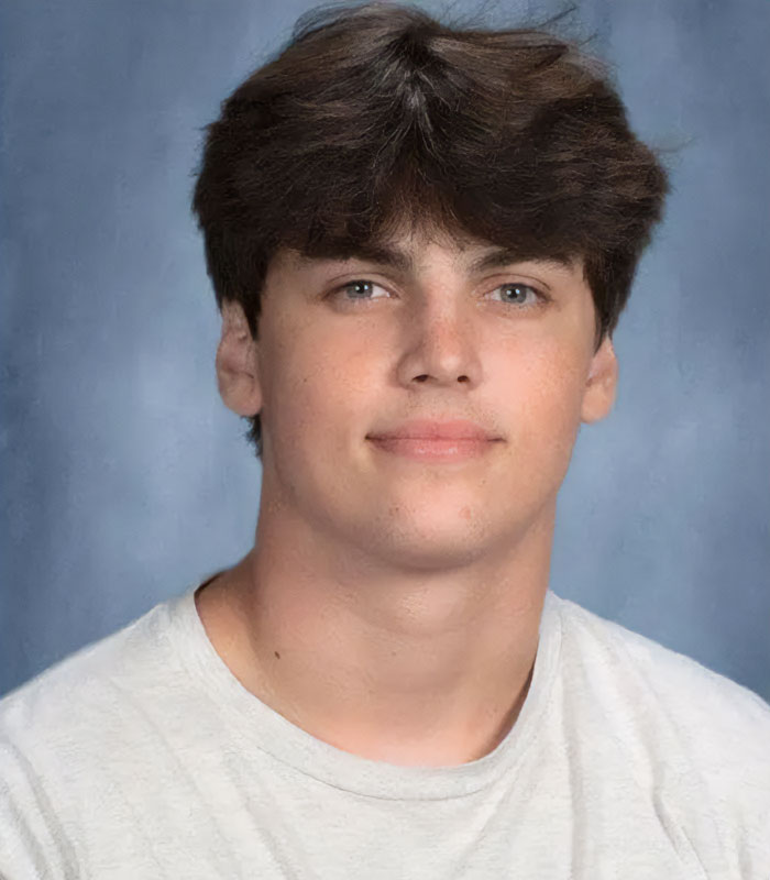 A young man with brown hair, possibly Karmelo Anthony, revealing hateful texts from new court documents.