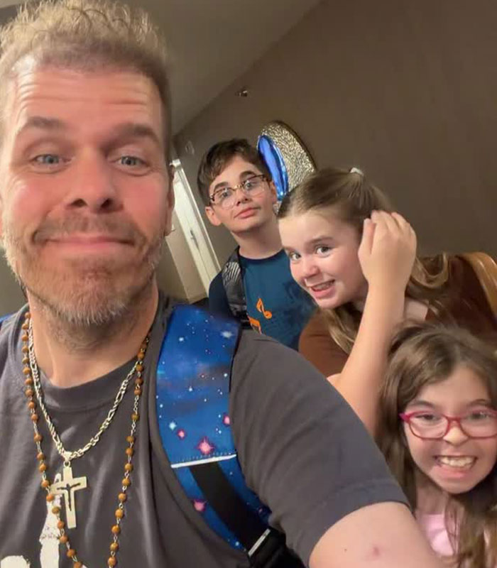 Perez Hilton in a selfie with his children, raising concerns amidst his crisis. Perez Hilton in a selfie with his children, raising concerns amidst his crisis.
