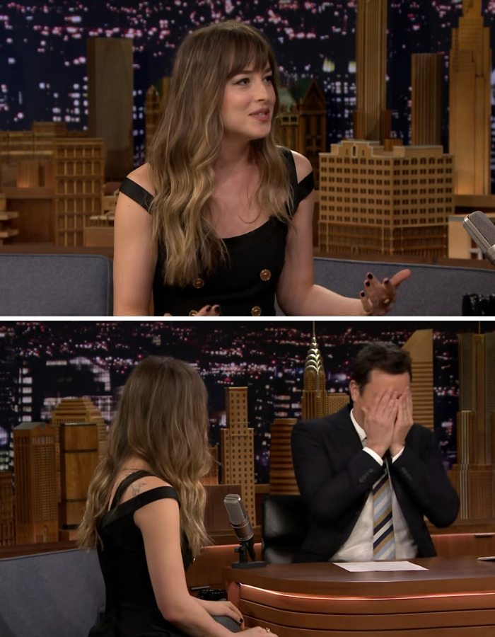 Dakota Johnson, a female star, reacts to a man during an interview.