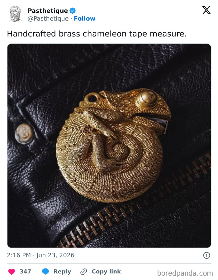 Aesthetic art piece of a handcrafted brass chameleon tape measure coiled on black leather