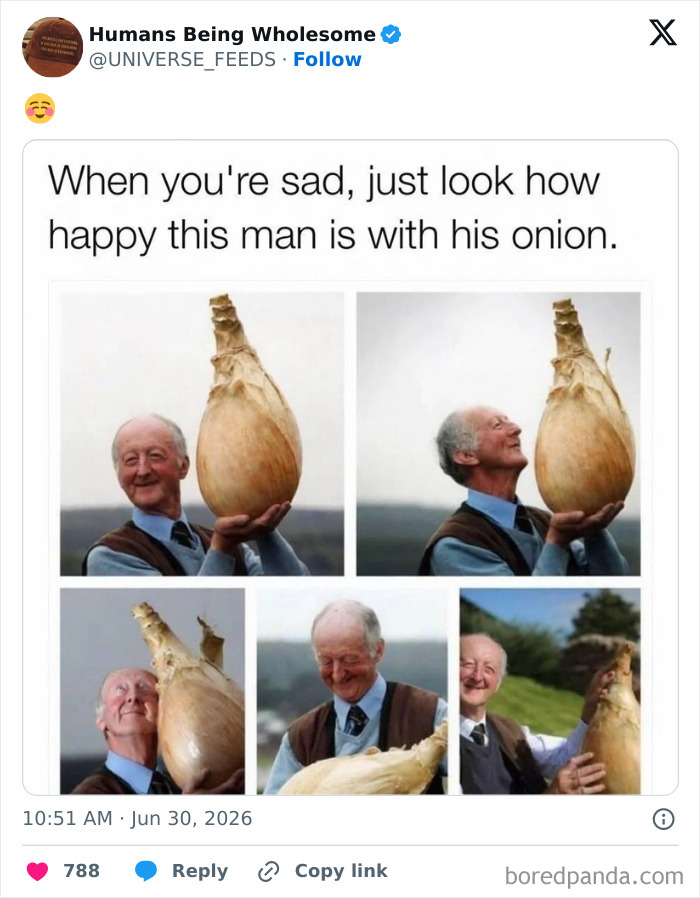 Happy man proudly holding and admiring a giant onion on his farm