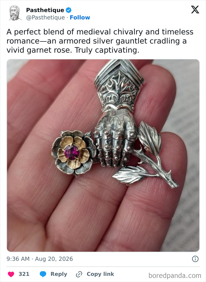 An ornate silver gauntlet holding a garnet rose, reflecting medieval history and aesthetic culture