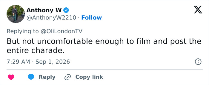 Tweet from Anthony W pointing out the trans woman was not too uncomfortable to film and post the incident.