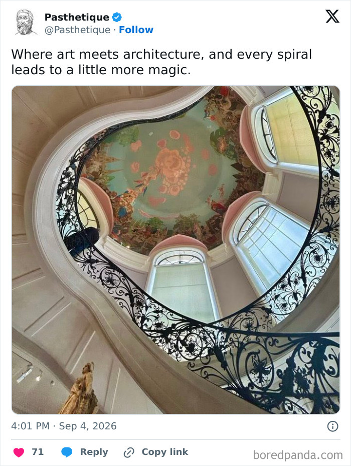 An ornate spiral staircase leading to a painted ceiling, blending history and culture.