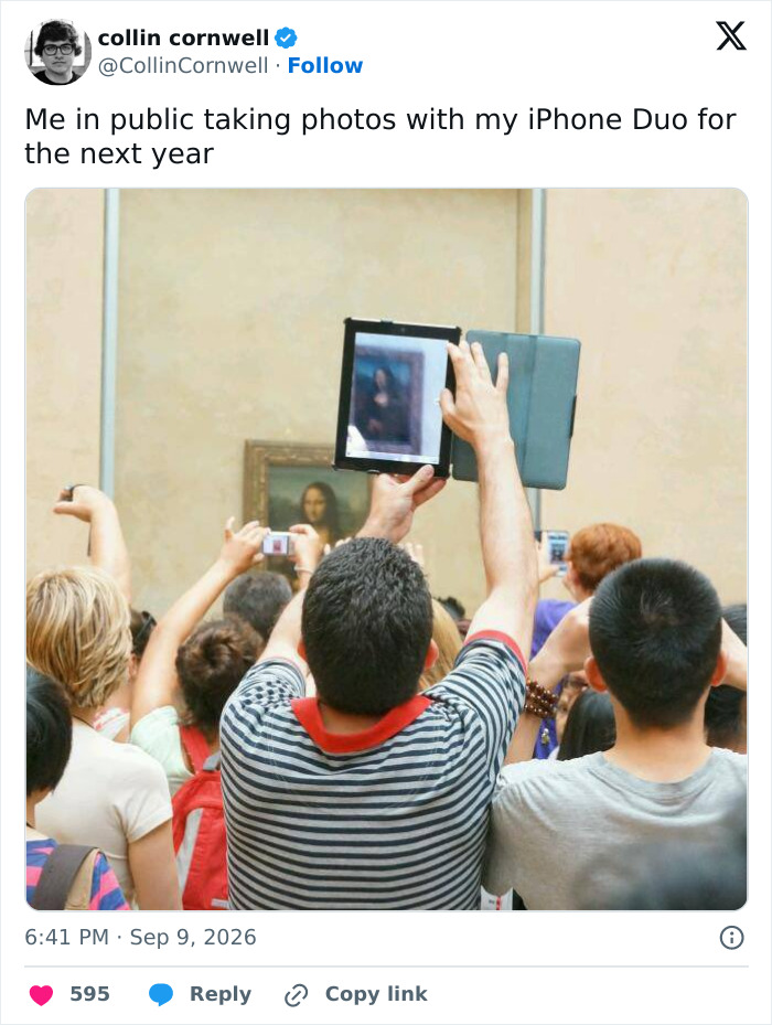 A person holding a foldable iPhone with a cover, using it to photograph the Mona Lisa in a crowded museum, like an iPhone Duo.