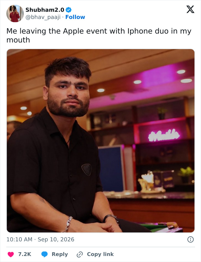 Twitter post featuring a man with a tiny phone in his mouth, a funny reaction to the Foldable iPhone.