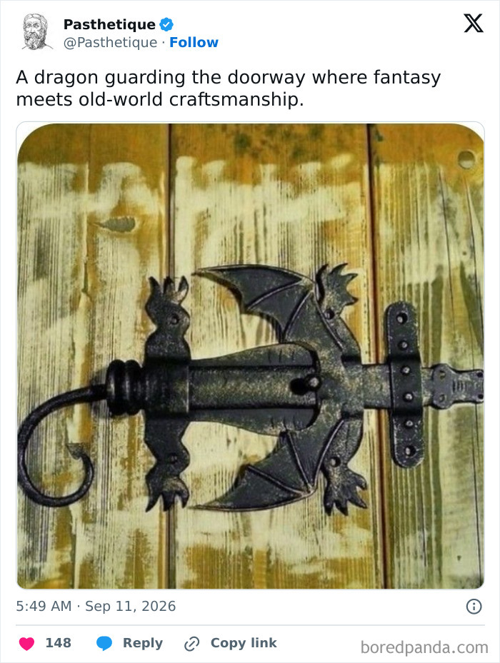 Close-up of a dragon-shaped metal door latch, highlighting classic craft from history.