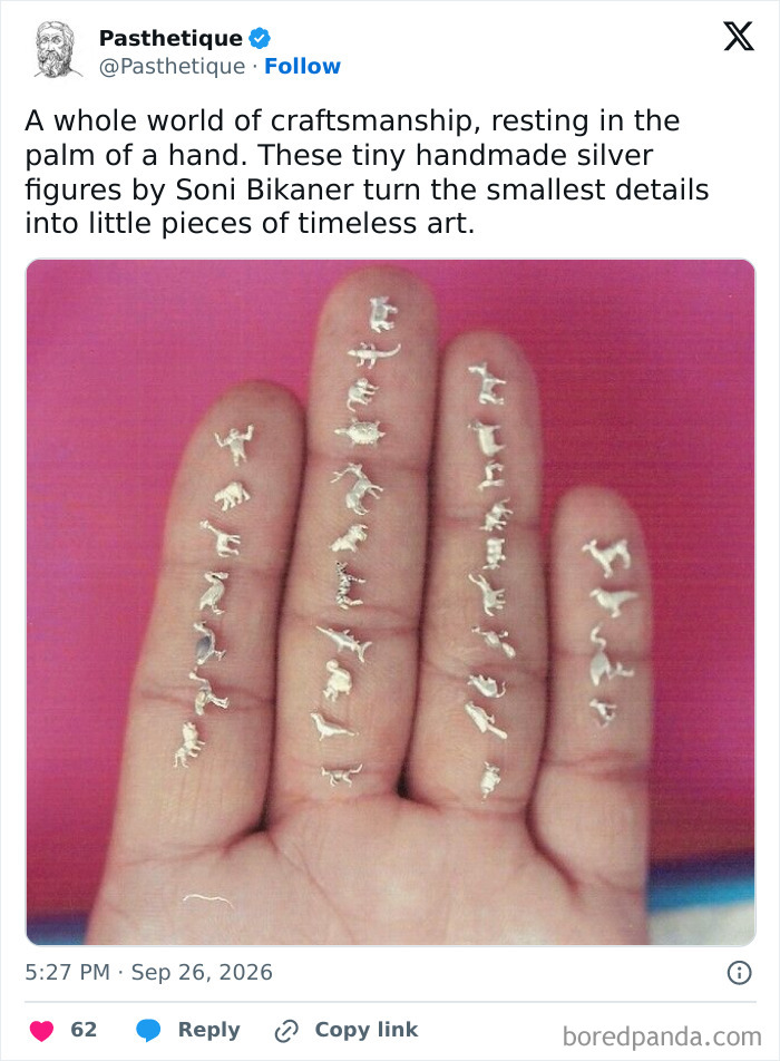 Tiny silver animal figures displayed on fingers, showcasing aesthetic art and handmade craftsmanship.