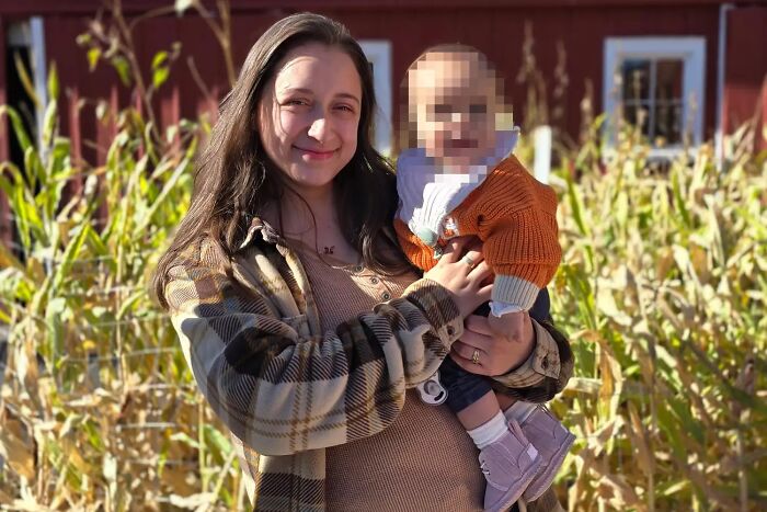 Woman holding baby outdoors in a morbid curiosity story image