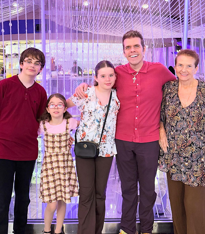 Perez Hilton with his family, including an older woman, raising fresh concerns. Perez Hilton with his family, including an older woman, raising fresh concerns.