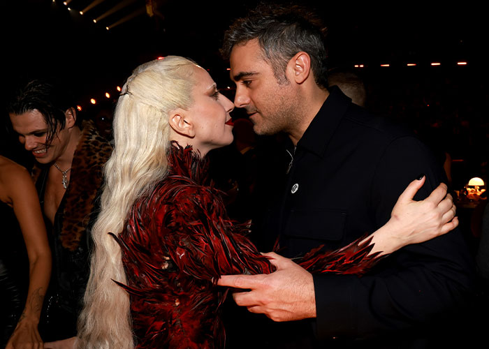Lady Gaga and Michael Polansky are facing criticism for their baby girl name choice, seen here in an embrace.
