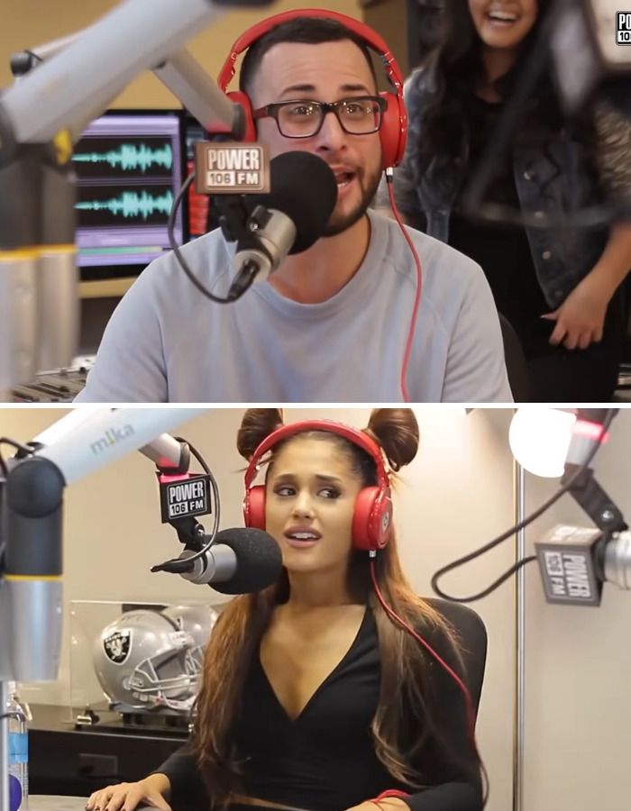 Ariana Grande, a female star, reacts to a man while wearing red headphones.