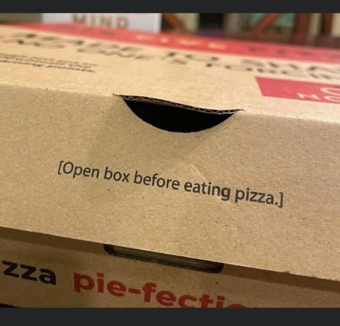 Pizza box with funny instruction to open box before eating pizza