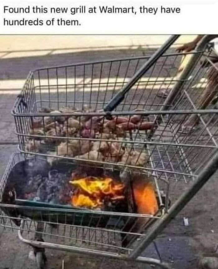 Shopping cart grill with fire and potatoes as a funny outdoor grill setup