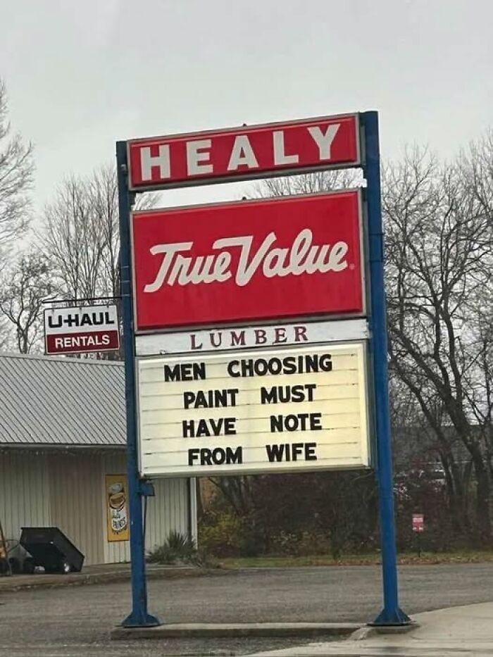 A silly-funny sign at Healy True Value, Men choosing paint must have note from wife.