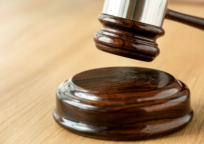 A wooden gavel and sound block symbolizing court arguments
