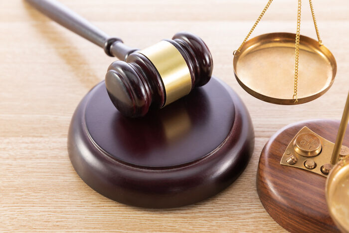 A judge's gavel and scales of justice used by lawyers in court