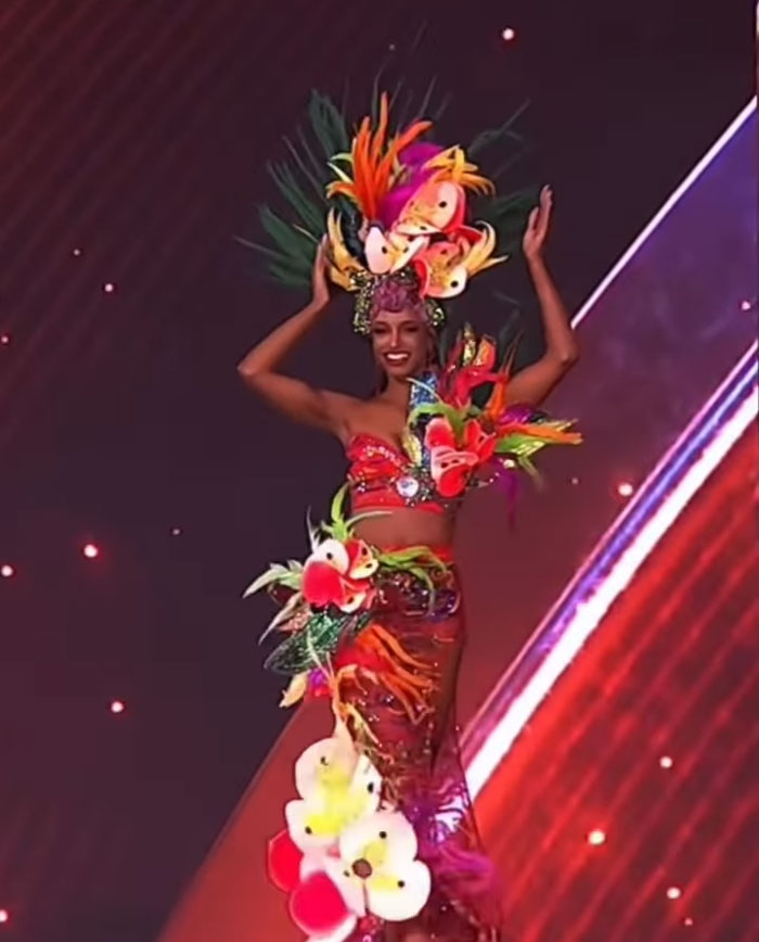 Miss Universe Jamaica Gabrielle Henry showcasing a colorful costume with feathers at national costume segment Miss Universe Jamaica Gabrielle Henry showcasing a colorful costume with feathers at national costume segment