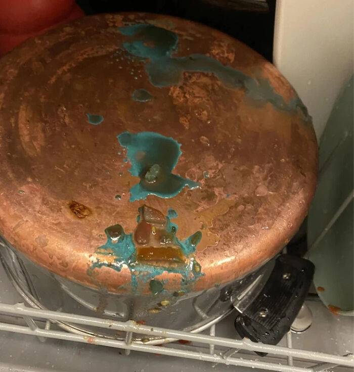 An interesting photo of a copper pot showing blue-green chemical oxidation after a dishwasher cycle