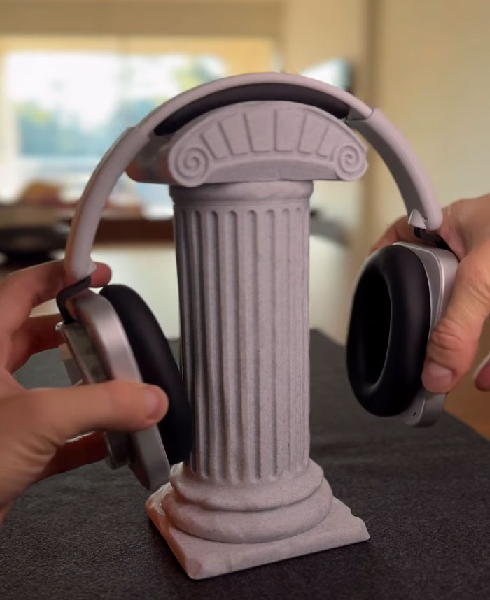3D printed headphone stand shaped like a classical column holding headphones